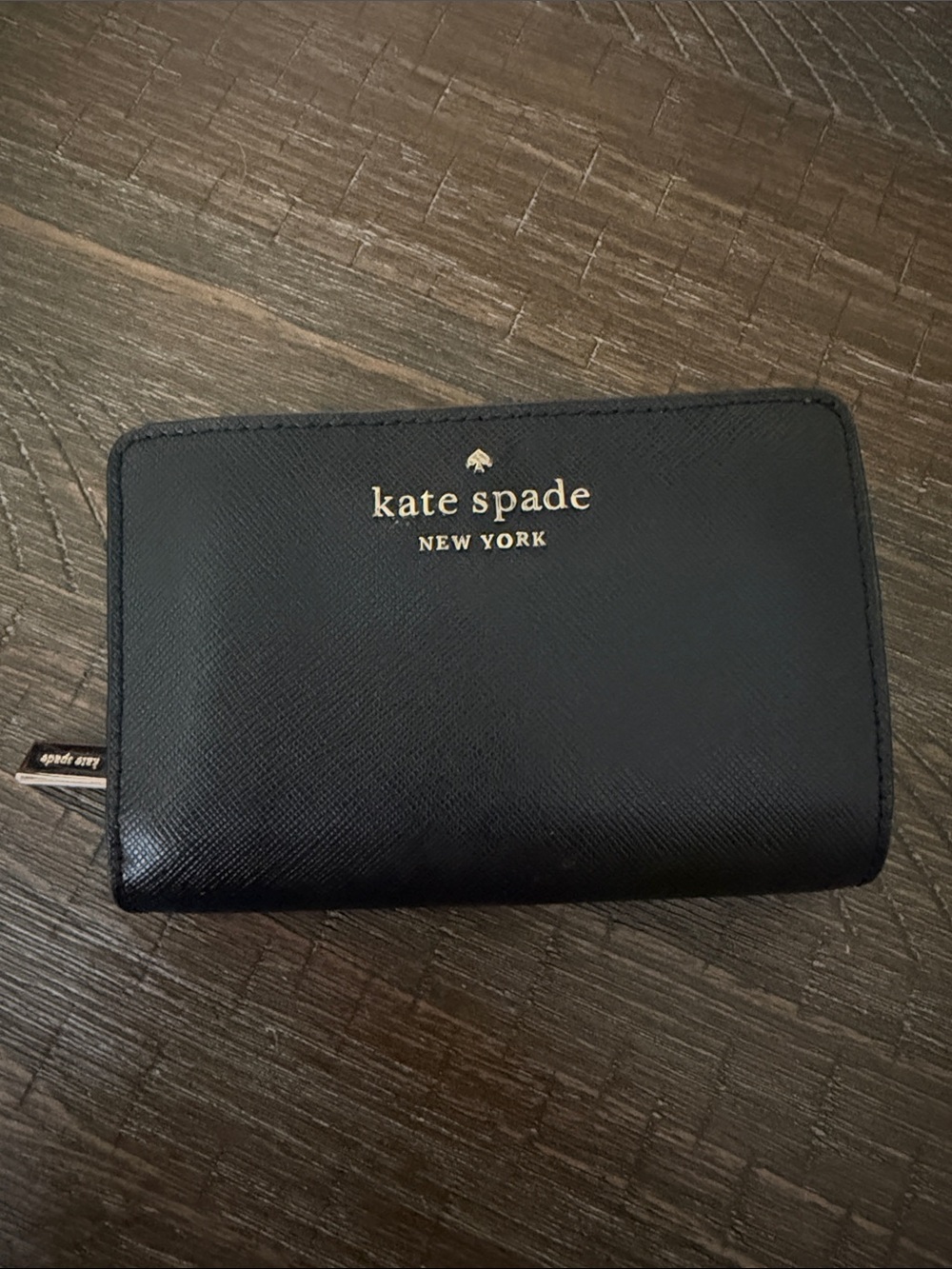 kate spade black and gold zip-around wallet